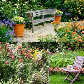 Blühende Kleingartenanlage mit bunten Blumenbeeten, einer Gartenbank auf einer Terrasse und einem Stuhl mit Kaffeetasse im grünen Garten.
